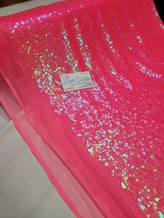 pink and gold sequin fabric with name tag