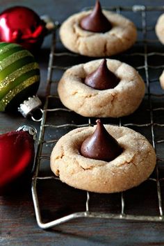 cookies are cooling on a rack with christmas ornaments