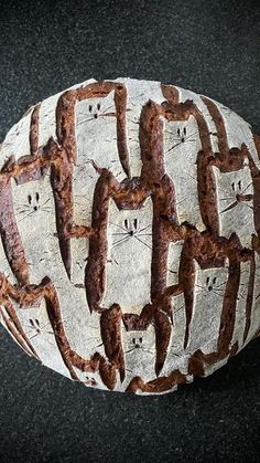 a loaf of bread with faces drawn on it