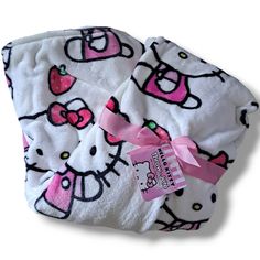 the hello kitty blanket has pink bows on it