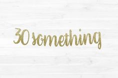 the word'something'written in gold glitter on a white wood background with an arrow