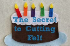 a birthday cake with candles on it and the words, the secret to cutting felt