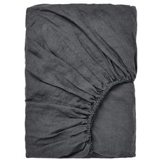 a gray blanket with ruffles on it