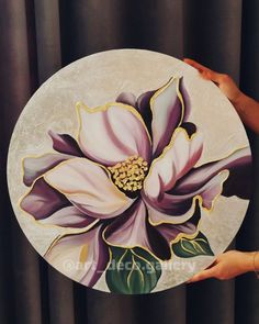 a painting of a large purple flower on a white plate with gold trimmings