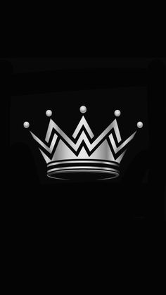 a black and white photo of a crown on a dark background with the word king written across it