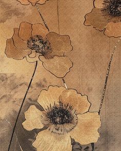 three flowers are shown in this artistic painting