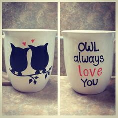 two coffee mugs decorated with owls and words