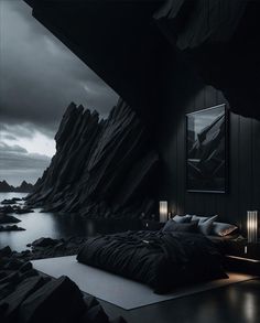 a bed sitting in the middle of a room next to a large rock covered hillside