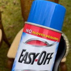 an easyoff spray can sitting on top of a chair