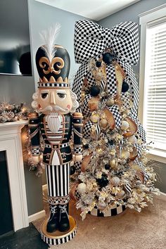 two nutcrackers are standing next to a christmas tree in a living room