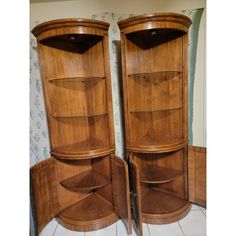 two wooden corner shelves sitting next to each other