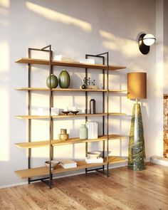 a shelf with books and vases on it in the corner of a living room