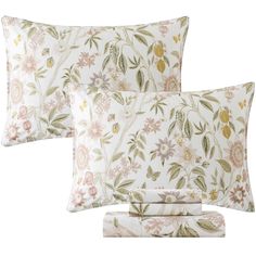 two pillows with floral print on them, one in white and the other in pink