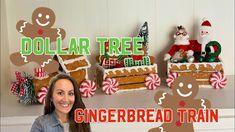 a woman standing in front of gingerbread train