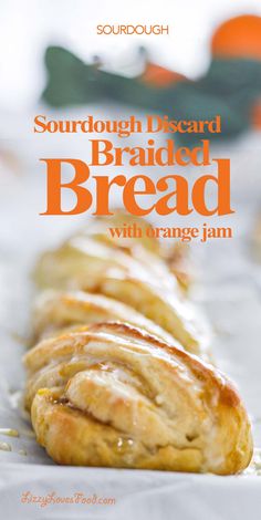 an image of bread with orange glaze on the top and in the bottom text reads sourdough decadend braided bread with orange jam