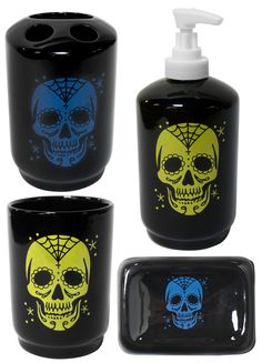 three black containers with yellow and blue skulls on them, one holding a soap dispenser