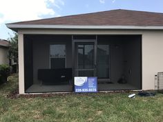 a house with a sign in front of it