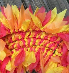 a close up view of some colorful paper flowers