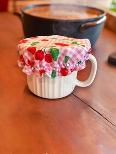 a cupcake cover sitting on top of a wooden table