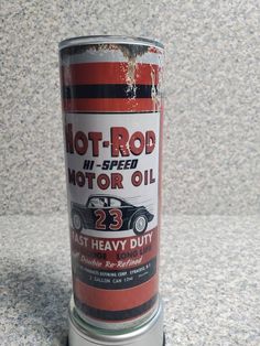 a can of hot rod motor oil sitting on top of a granite counter next to a wall