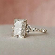 an engagement ring with a cushion cut diamond