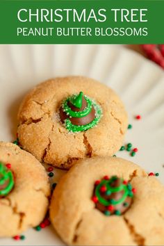 three christmas tree peanut butter blossoms on a plate