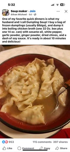 a red bowl filled with dumplings on top of a table