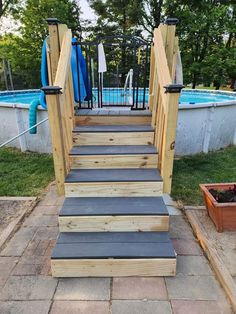 a set of steps leading up to a swimming pool