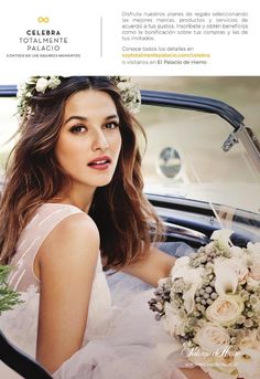 a beautiful woman sitting in the back of a car with flowers on her head and holding a bouquet