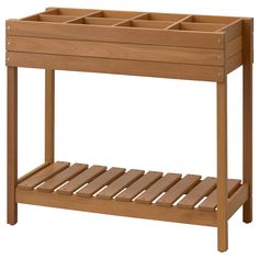 a wooden shelf with two compartments on it