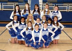 the cheerleaders are posing for a group photo