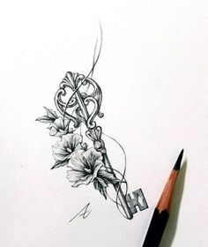 a pencil drawing of a key with flowers on it