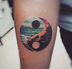 an image of a tattoo on someone's leg with the yin symbol painted on it