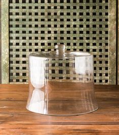 a clear plastic container sitting on top of a wooden table