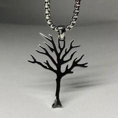 The Leafless Tree Necklace  embodies the powerful symbolism of growth, strength, and the cycles of life. Featuring an intricately crafted tree pendant with bare branches, this unique necklace serves as a reminder that even during life’s most challenging moments, there is beauty, resilience, and the potential for renewal. The leafless tree, though without leaves, symbolizes the promise of new beginnings and the endurance that comes from weathering difficult times.  Handcrafted with attention to detail, the pendant is made from high-quality materials, available in sterling silver, gold, or rose gold, ensuring both elegance and durability. The simple yet meaningful design of the Leafless Tree Necklace  makes it a versatile accessory that can be worn with any outfit, whether casual or formal. Leafless Tree, Tree Necklace, Tree Of Life Necklace, Tree Of Life Pendant, Tree Design, Stunning Necklace, Life Design, Stylish Jewelry, Stainless Steel Necklace