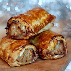 three sausage rolls stacked on top of each other in front of some tinseling