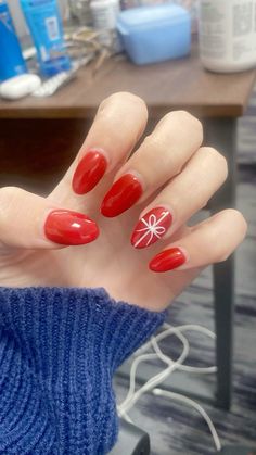 Christmas Theme Nails Simple, Red Holiday Nail Designs Almond, Easy Red And White Christmas Nails, Trending Christmas Nails 2024, Christmas Nails One Nail Design, Red Christmas Present Nails, Trendy Xmas Nails, Cute Simple Nails Christmas, Red Present Nails