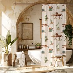 a bathroom with a shower curtain, toilet and bathtub covered in horse images on it