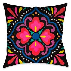 a black pillow with colorful flowers on it