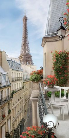 the view of the eiffel tower from an apartment balcony