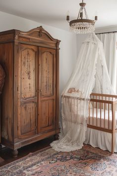 a baby's room with a crib, dresser and bed in the corner