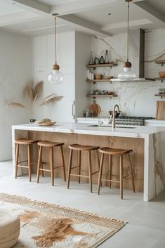 a kitchen with marble counter tops and wooden stools