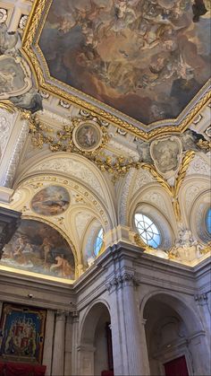 an ornate ceiling with paintings on it