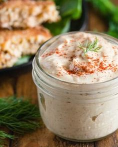 a jar filled with food sitting on top of a wooden table