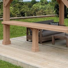 a wooden bench sitting on top of a wooden deck