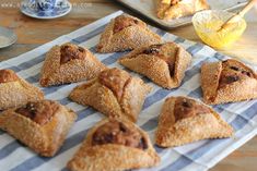 several pastries are arranged on a blue and white towel