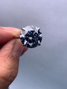 a person holding a diamond in their hand