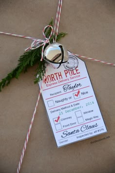 a paper tag with a christmas ornament attached to it