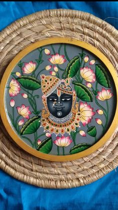 a decorative plate with a buddha face on it