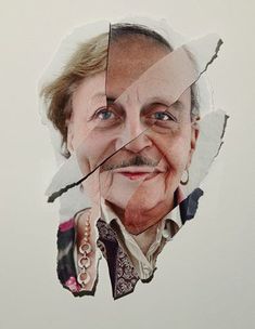 an old woman's face is shown through the torn up piece of paper that has been cut out